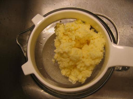 The butter as it looks after just being dumped into the strainer.