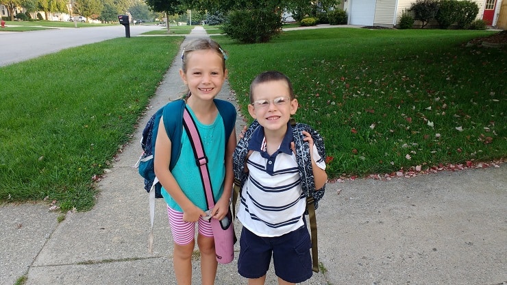 Two kids ready for the first day of school