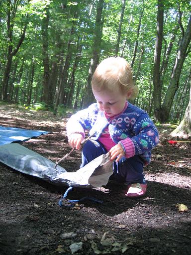 Toddler playing with sticks