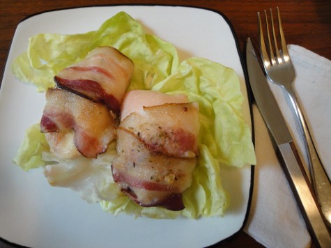 A plate of Puerto Rican Chicken on a butter lettuce leaf