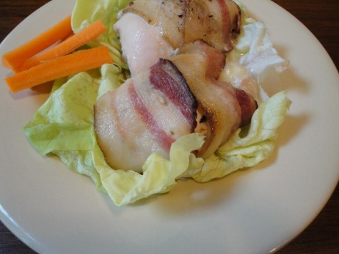 A plate of Puerto Rican Chicken on a butter lettuce leaf