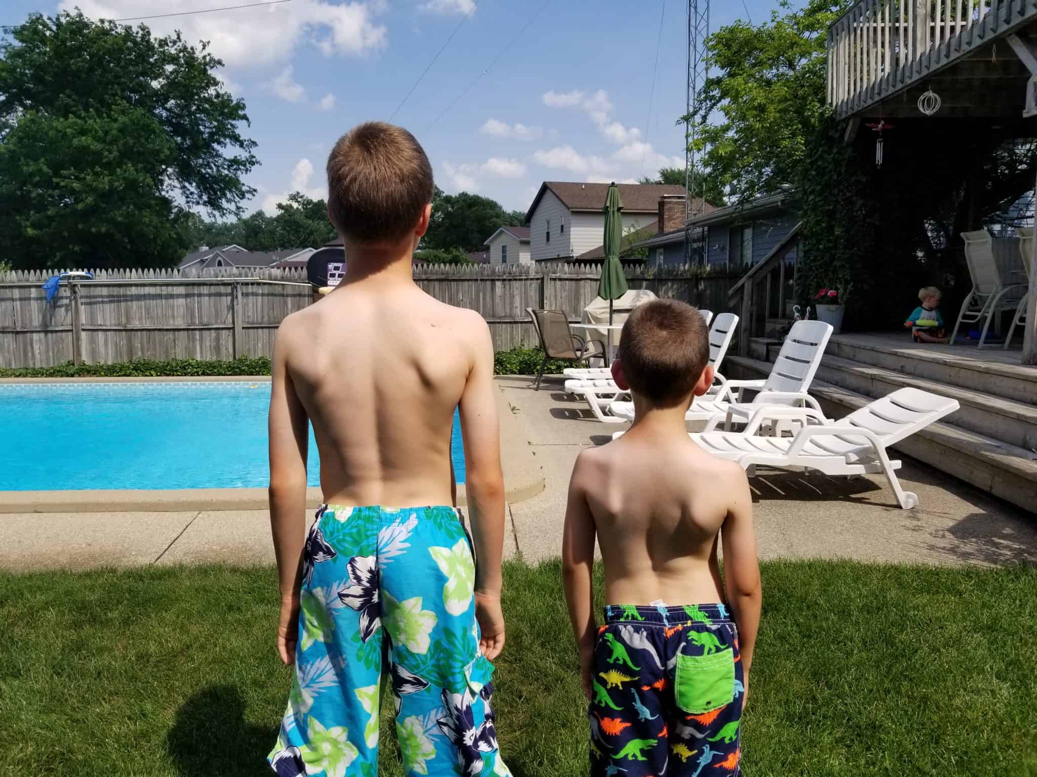 Boys at the pool with sunscreen