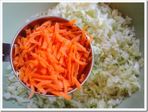 Making fermented kimchi - freshly shredded carrots