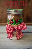 A mason jar with monster cookie mix from Desserts in Jars by Shaina Olmanson