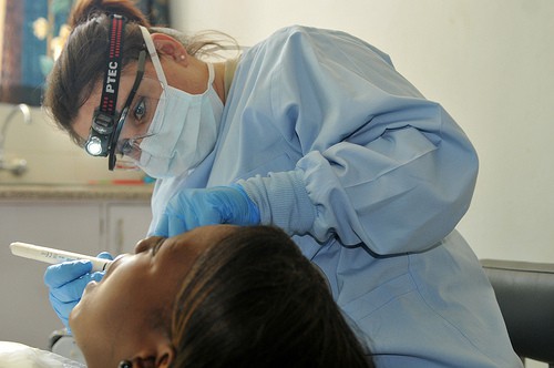 A dentist working on a patient