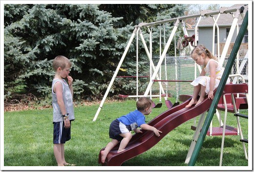 kids playing on new swingset