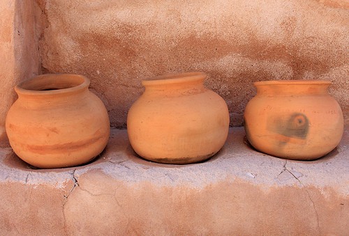 Clay jars on a rock ledge