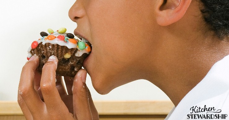 boy eating cupcake