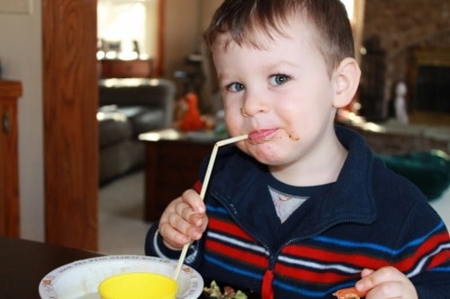 Kids eating creamy cauliflower soup with straws