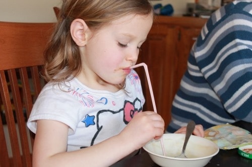 Kids eating creamy cauliflower soup with straws