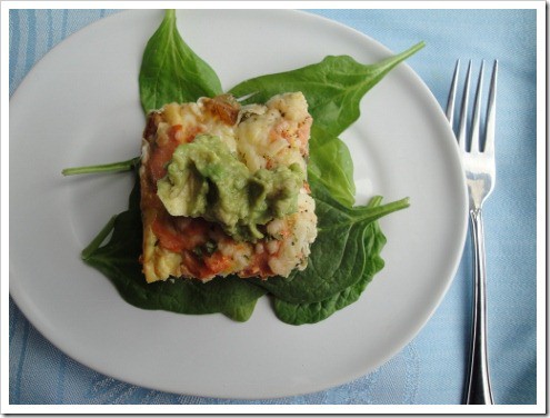 Salmon Spinach Pesto Crustless Quiche on a bed of leafy greens