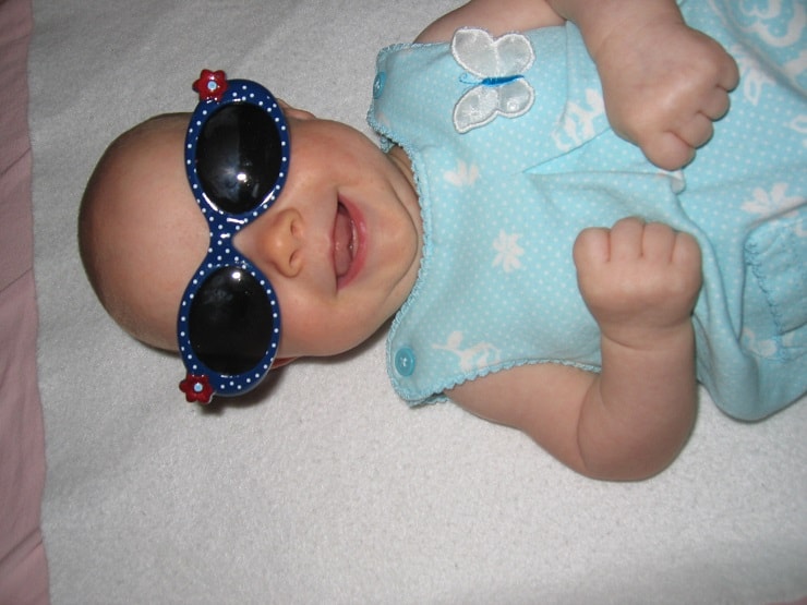 A baby with sunglasses on