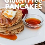 Stack of gluten-free pancakes topped with butter and syrup