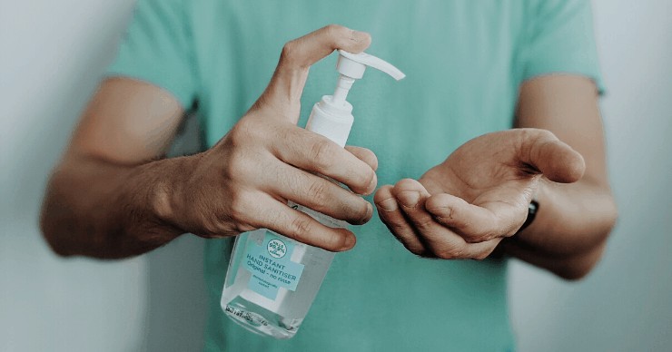 using hand sanitizer