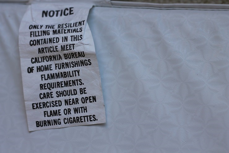 Flame retardant info tag on changing table pad California Bulletin