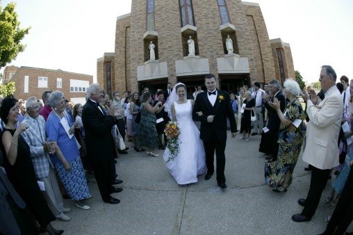 Bride and groom exiting a church