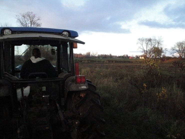 Tilling the field with a tractor