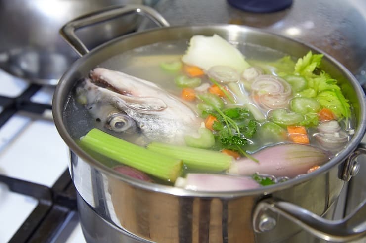 Cooking salmon fish broth with a vegetables