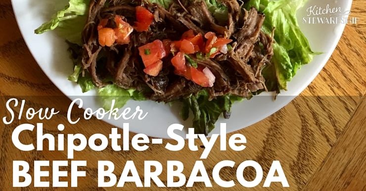 Instant Pot Barbacoa Beef (chipotle-style copycat) on a bed of greens with diced tomatoes