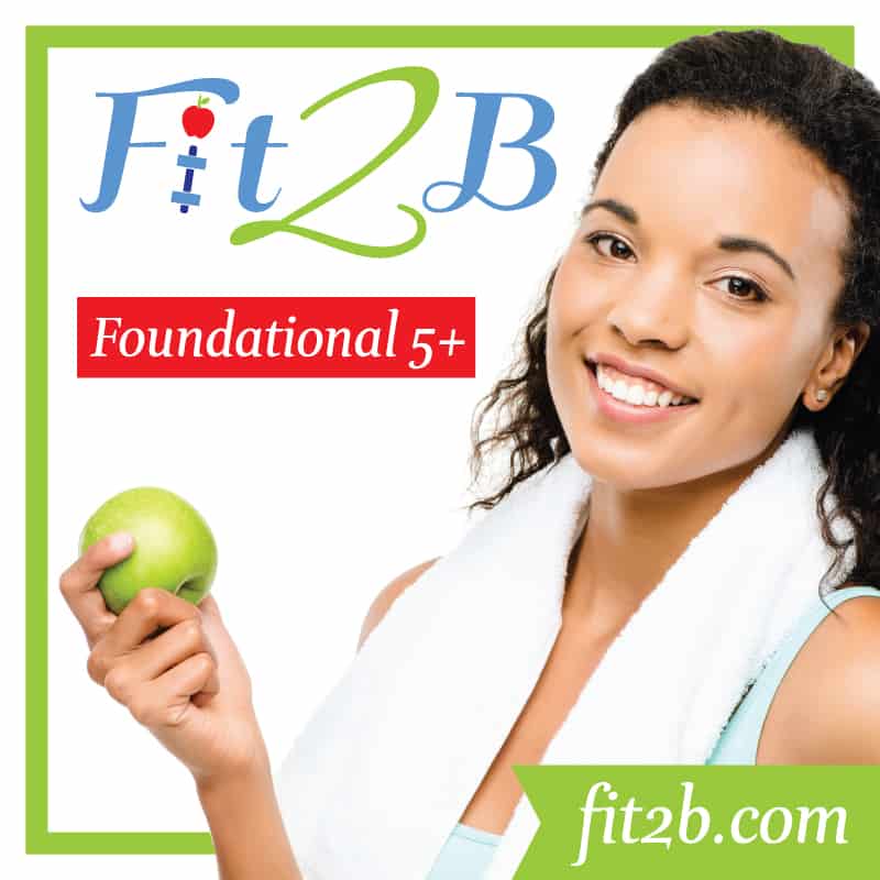 Fit 2 B Foundational 5+. Woman holding an apple with a towel draped around her neck. 