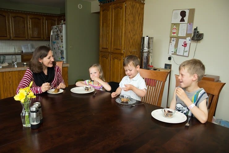 family at the table eating real food