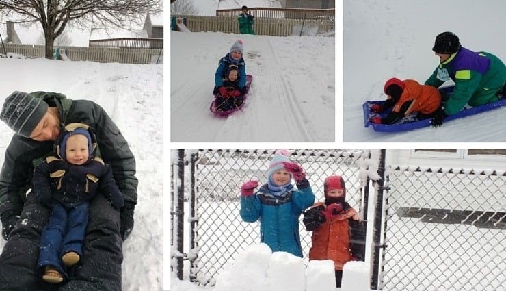 Having fun sledding outside in the winter snow