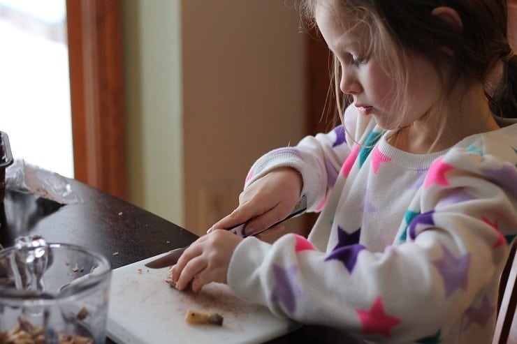 Leah cutting mushrooms for the Instant Pot chicken cacciatore
