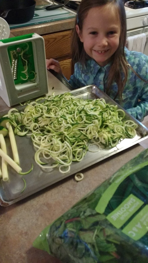 kids help with making zoodles with a spiralizer