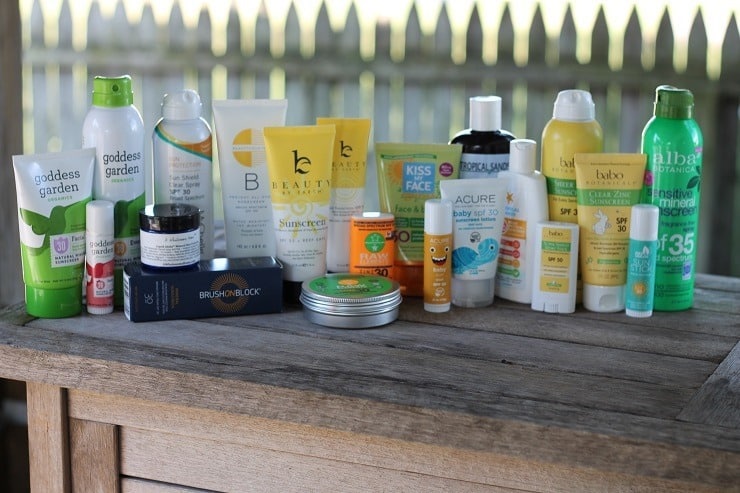 Wood table with a dozen mineral based sunscreens. 