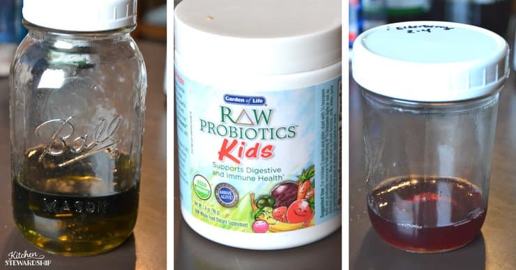 Jars with herbal infusions in them and a bottle of Raw Probiotics Kids.