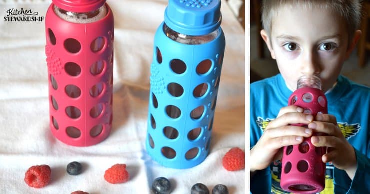 Red and blue lifefactory water bottles on a white towel with raspberries and blueberries. Picture the right shows a young boy drinking from the red water bottle.