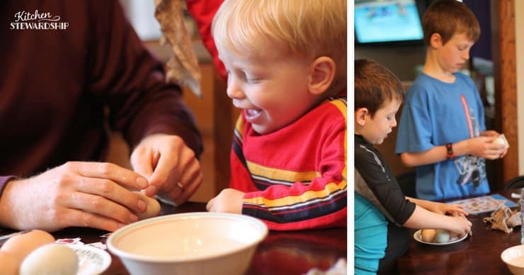 Dad helping toddler decorate Easter eggs with temporary tattoos. Two young boys decorating eggs with temporary tattoos.