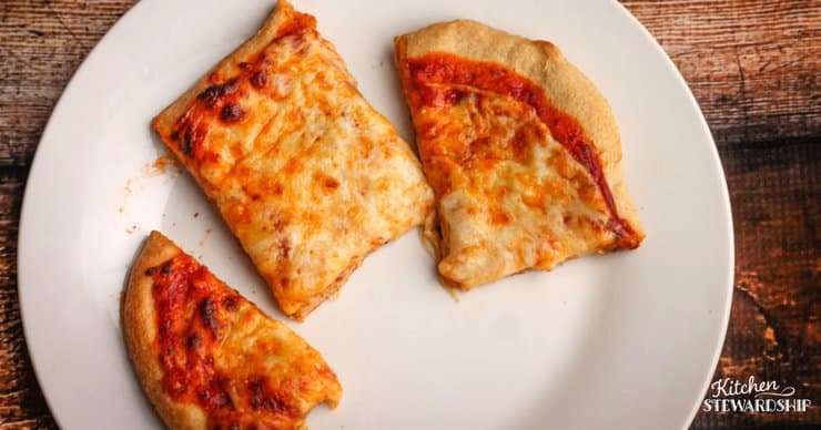 Cheese whole wheat crust pizza with gooey cheese and a crispy crust.