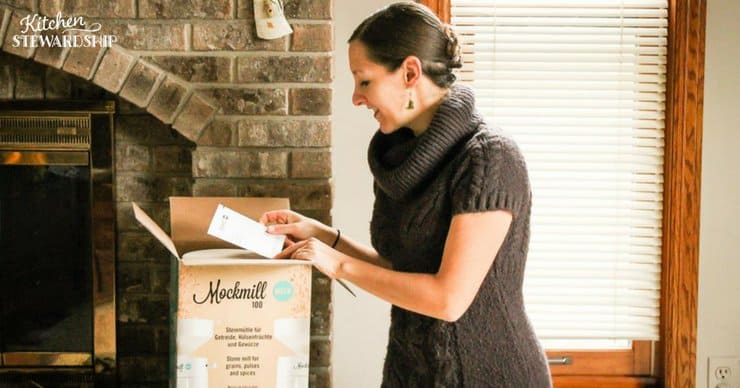 Katie Kimball of Kitchen Stewardship opening her Mockmill grain mill.