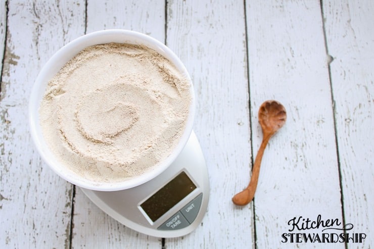 100% whole grain gluten-free flour blend in a bowl on the scale. 