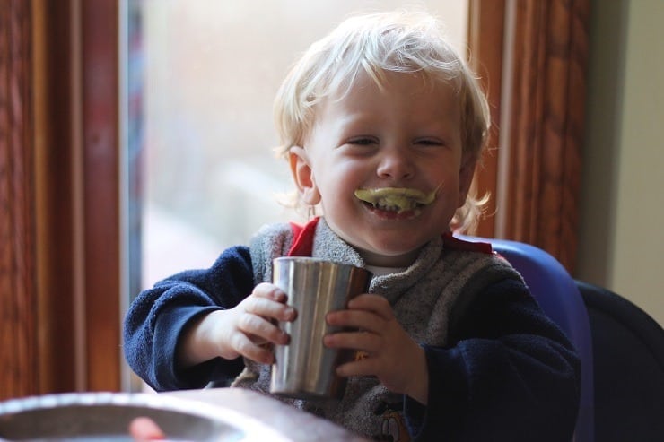 boy with healthy smoothie mustache