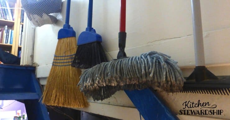 Using the wall space in the stairwell to organize cleaninig supplies. 