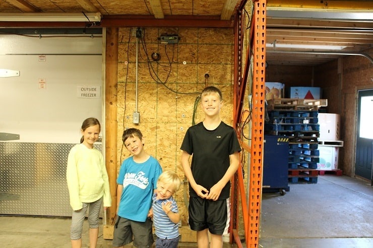 Kids Cook Real Food kids weighing themselves at Buist Community Assistance Center