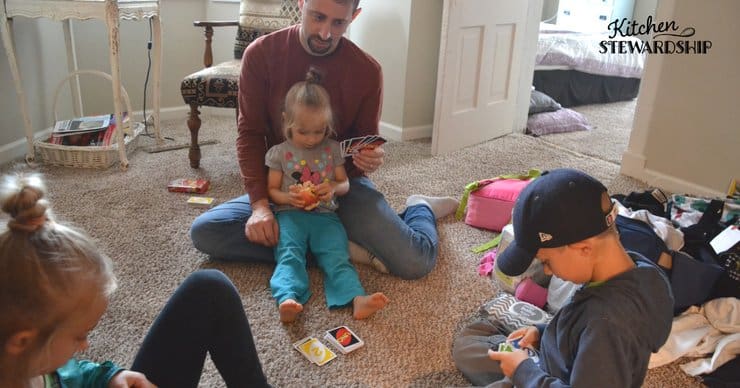Family playing a card game