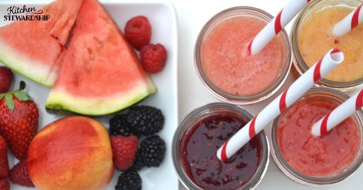 Fresh fruit (watermelon, strawberries, blackberries, raspberries and a nectarine) next to fruit smoothies. Red dyes in food aren't needed to make these foods look appealing and delicious!