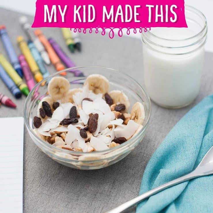 bowl of bananas, coconut, nuts and raisins - monkey salad made by kids