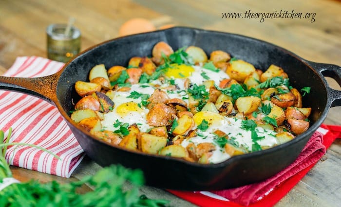 crispy potatoes and eggs in a skillet
