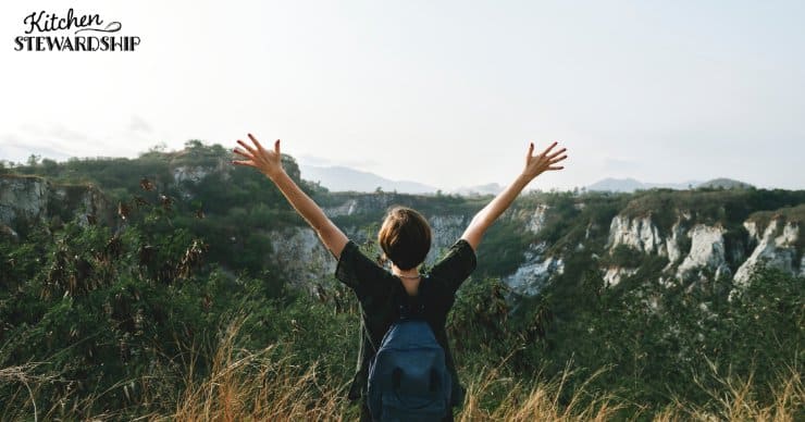 hiker looking out over mountain view