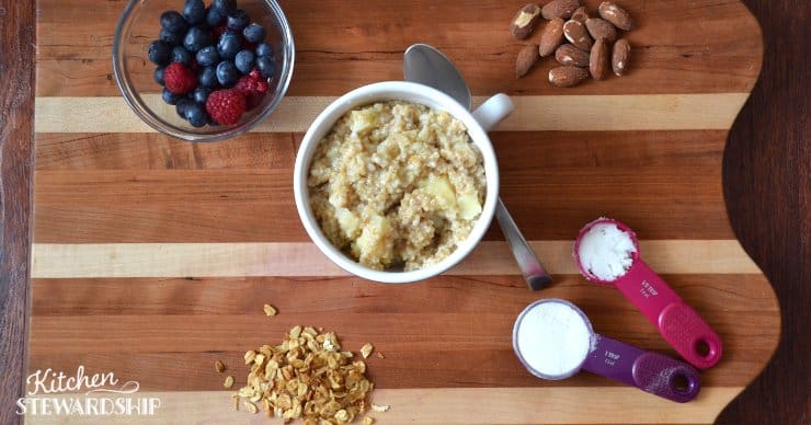 bowl of steel cut oatmeal with toppings - berries, almonds, sugar, granola