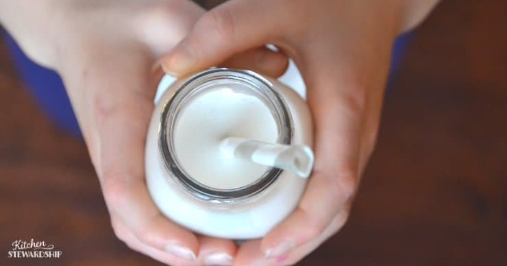 Milk in a jar with a straw