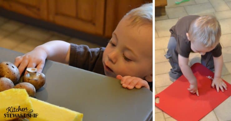 Toddler playing with mushrooms and a cutting board