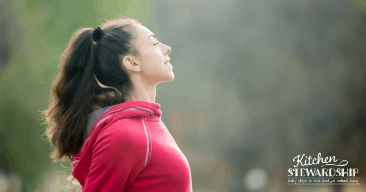 Woman taking a deep breath