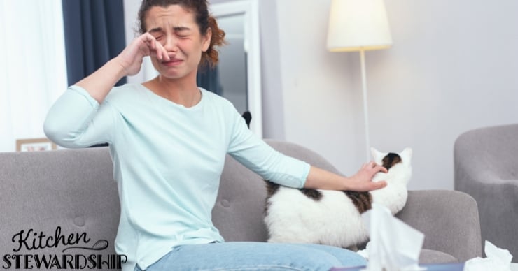 girl with tissues on the couch