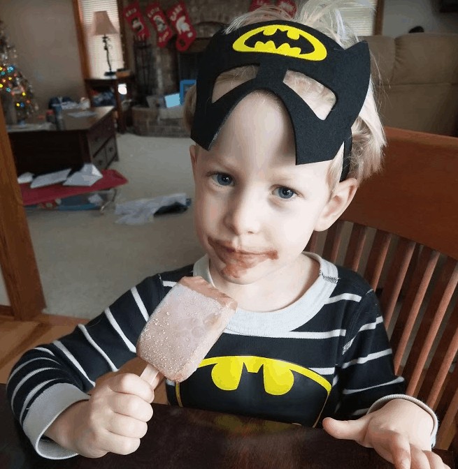 little boy wearing Batman mask, healthy birthday treats