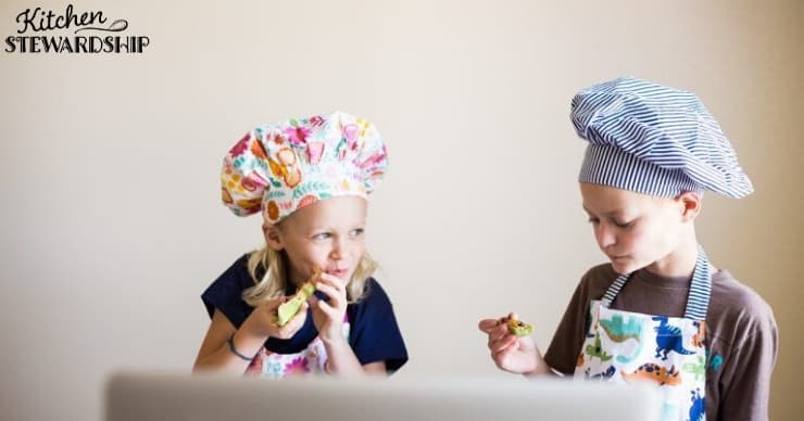 kids eating celery in front of a laptop